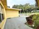 Large patio with view of the backyard and surrounding landscape at 10908 W Elbow Dr, Tampa, FL 33612