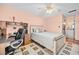 Spacious bedroom with a built-in desk and ensuite bathroom access at 1122 84Th N Ter # C, St Petersburg, FL 33702