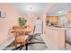 Dining area with wooden table and chairs, and kitchen views at 1122 84Th N Ter # C, St Petersburg, FL 33702