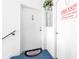 Apartment entryway with fire extinguisher and welcome mat at 1122 84Th N Ter # C, St Petersburg, FL 33702