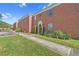 Brick building exterior, featuring a walkway and landscaping at 1122 84Th N Ter # C, St Petersburg, FL 33702