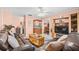 Living room with leather sofas and a view into the dining area at 1122 84Th N Ter # C, St Petersburg, FL 33702