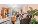 Living room with leather sofas, coffee table, and access to patio at 1122 84Th N Ter # C, St Petersburg, FL 33702