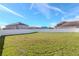 Large backyard with a white fence at 13167 Royal Pines Ave, Riverview, FL 33579
