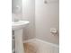 Simple bathroom with pedestal sink and tiled floor at 13167 Royal Pines Ave, Riverview, FL 33579