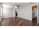 Bright bedroom with hardwood floors and ceiling fan at 13167 Royal Pines Ave, Riverview, FL 33579