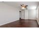 Spacious bedroom with hardwood floors and ceiling fan at 13167 Royal Pines Ave, Riverview, FL 33579