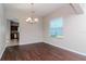 Bright dining room with hardwood floors and chandelier at 13167 Royal Pines Ave, Riverview, FL 33579