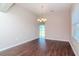 Bright dining room with hardwood floors, chandelier, and access to patio at 13167 Royal Pines Ave, Riverview, FL 33579