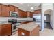 Modern kitchen with stainless steel appliances and granite countertops at 13167 Royal Pines Ave, Riverview, FL 33579