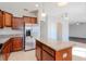 Kitchen features stainless steel appliances and an island at 13167 Royal Pines Ave, Riverview, FL 33579
