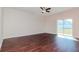 Living room with dark hardwood floors and sliding glass doors at 13167 Royal Pines Ave, Riverview, FL 33579