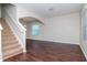 Dark hardwood floors and neutral-toned walls in spacious living room at 13167 Royal Pines Ave, Riverview, FL 33579