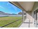 Screened porch with view of backyard and neighborhood at 13167 Royal Pines Ave, Riverview, FL 33579