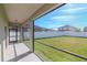 Screened porch overlooking a grassy backyard at 13167 Royal Pines Ave, Riverview, FL 33579