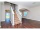 Beige carpeting on stairs, dark hardwood floors, and view into living area at 13167 Royal Pines Ave, Riverview, FL 33579