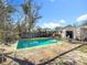 Inviting backyard oasis featuring a refreshing pool, ideal for relaxation and entertainment at 1517 Young Ave, Clearwater, FL 33756