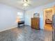 Bedroom with wood dresser and access to another room at 1517 Young Ave, Clearwater, FL 33756
