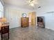 Bedroom with double doors and wood dresser at 1517 Young Ave, Clearwater, FL 33756