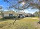 Charming house with a tree-lined yard and a spacious lawn at 1517 Young Ave, Clearwater, FL 33756