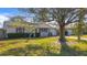 Charming single story home with mature landscaping and a spacious front yard at 1517 Young Ave, Clearwater, FL 33756