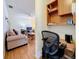 Home office with built-in shelves and view of living room at 1517 Young Ave, Clearwater, FL 33756