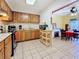 Kitchen with wood cabinets and a breakfast nook at 1517 Young Ave, Clearwater, FL 33756