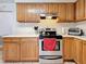 Kitchen with wood cabinets and stove at 1517 Young Ave, Clearwater, FL 33756