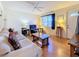 Bright living room with hardwood floors and comfortable seating at 1517 Young Ave, Clearwater, FL 33756