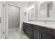 Double vanity bathroom with a walk-in shower and toilet at 16111 Churchview Dr, Lithia, FL 33547