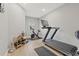 Home gym featuring Peloton bike and treadmill at 16111 Churchview Dr, Lithia, FL 33547