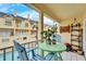 Balcony with small table and chairs, overlooking pool at 17960 Gulf Blvd # 123, Redington Shores, FL 33708