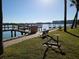 Community dock with seating and water access at 17960 Gulf Blvd # 123, Redington Shores, FL 33708