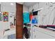 Cozy laundry room with front loading washer and dryer, as well as extra storage space and folding area at 2579 Countryside Blvd # 1105, Clearwater, FL 33761
