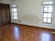 Bedroom with wood-look flooring and ample closet space at 3205 Pleasant Lake Dr, Tampa, FL 33618