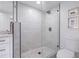 Bathroom with a walk-in shower, pebble flooring and modern vanity at 415 21St N St, St Petersburg, FL 33713