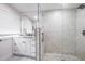 Modern bathroom with white cabinets, a walk-in shower, and pebble floor at 415 21St N St, St Petersburg, FL 33713