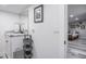 Bright bathroom features a vanity with granite countertop and a view of a bedroom at 415 21St N St, St Petersburg, FL 33713