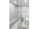 Bright bathroom, featuring a walk-in shower with gray tile and a toilet at 415 21St N St, St Petersburg, FL 33713