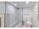Clean bathroom with a large walk-in shower and gray tile at 415 21St N St, St Petersburg, FL 33713