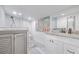 Spa-like bathroom with a walk-in shower, double vanity, and coastal art at 415 21St N St, St Petersburg, FL 33713