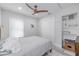 Bedroom with double bed, ceiling fan, and ample closet space at 415 21St N St, St Petersburg, FL 33713