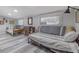 Bedroom with two daybeds, dresser and gray wood-look flooring at 415 21St N St, St Petersburg, FL 33713