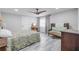 Bedroom with a queen bed, ceiling fan, and en-suite bathroom at 415 21St N St, St Petersburg, FL 33713