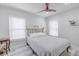 Bedroom with double bed, ceiling fan, and built-in shelving at 415 21St N St, St Petersburg, FL 33713