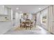 Open concept dining area with white cabinets and granite countertops at 415 21St N St, St Petersburg, FL 33713
