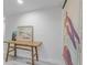 Bright entryway with wood console table, art, and light gray walls at 415 21St N St, St Petersburg, FL 33713