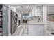 Renovated kitchen with white cabinets, granite counters, and stainless steel appliances at 415 21St N St, St Petersburg, FL 33713