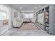Open living area with sectional sofa, built-in shelving and view into sunroom at 415 21St N St, St Petersburg, FL 33713
