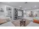 Open living space showcasing sectional sofa, built-in shelving and dining area at 415 21St N St, St Petersburg, FL 33713